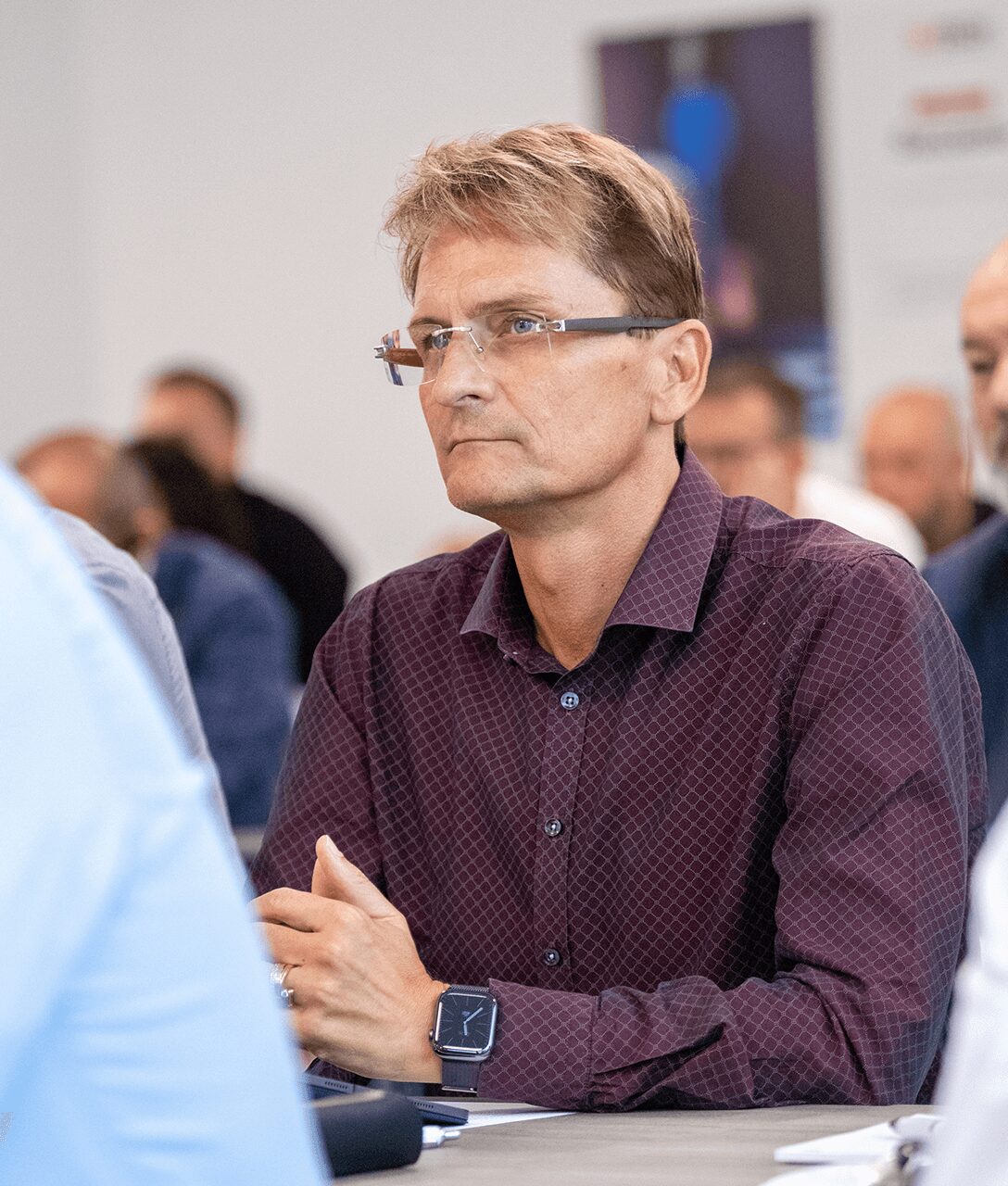 Photo of a Satech team member listening attentively on how Artificial Intelligence can boost sales, taken during the Satech 2024 Sales Conference