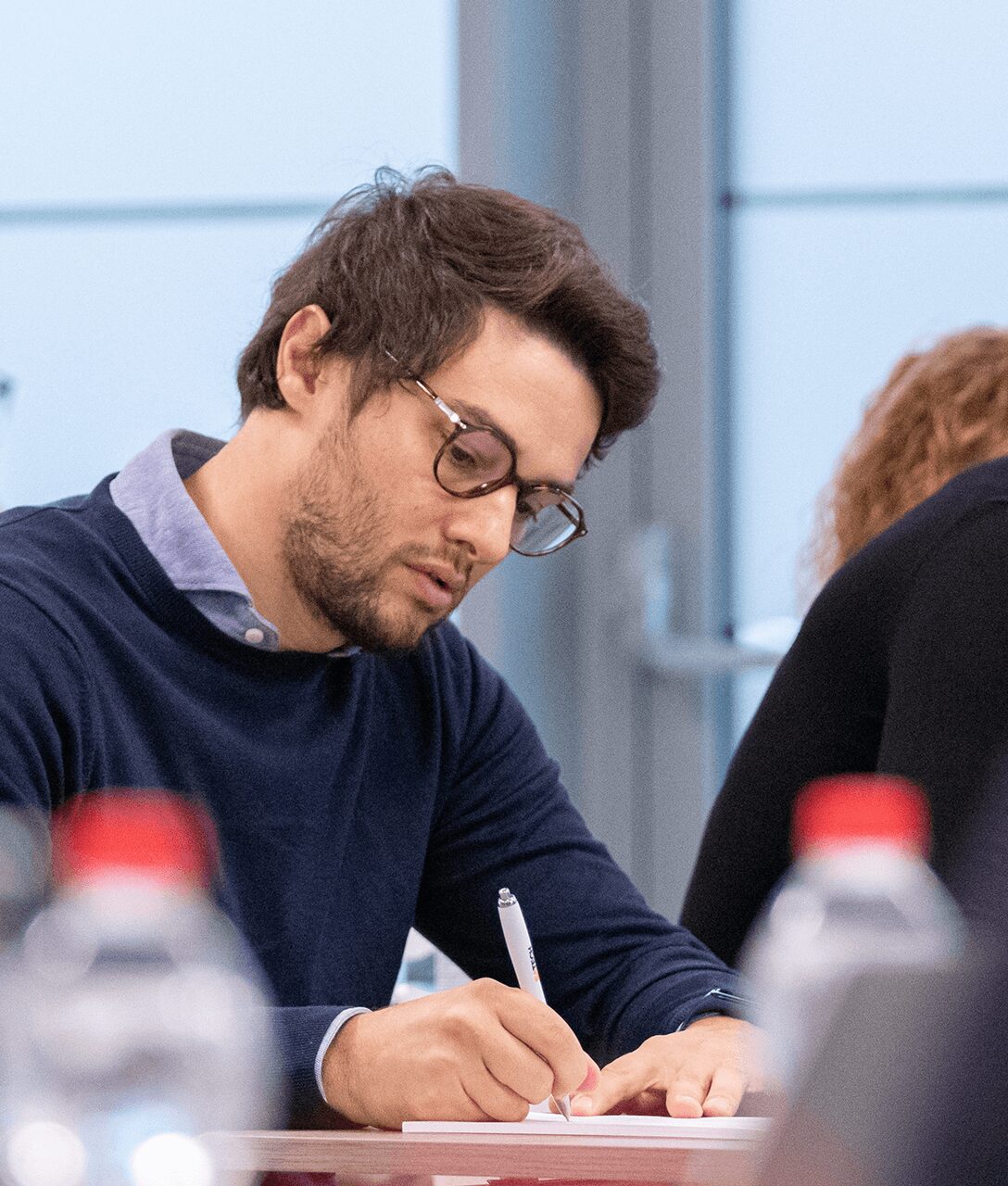 Close-up of the R&D Manager taking notes during the Satech 2024 Sales Conference